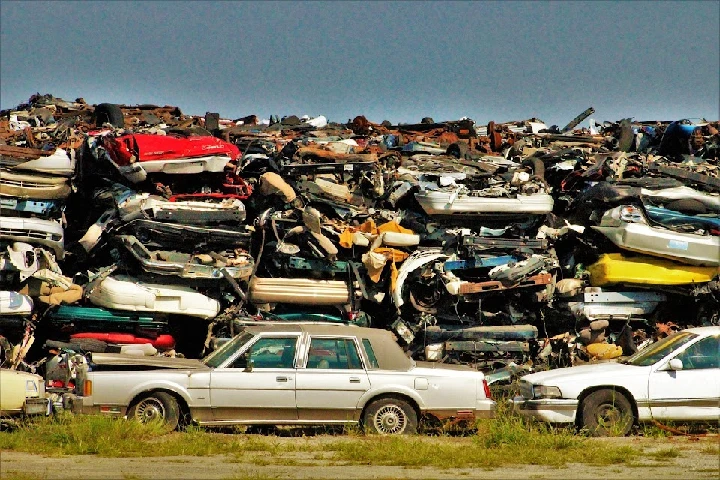 A large pile of crushed junk cars.