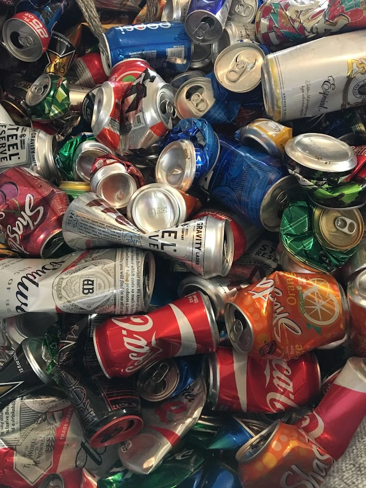 A pile of crushed aluminum beverage cans.