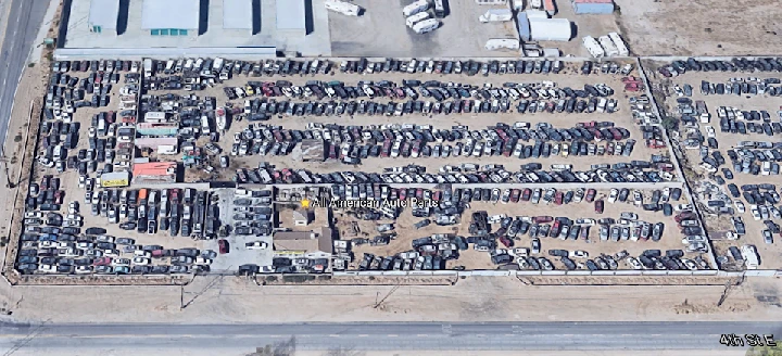 Aerial view of All American Auto Parts lot.