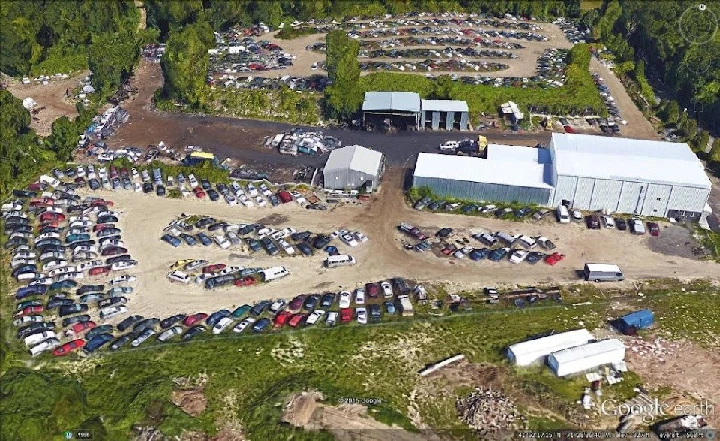 Aerial view of K & R Auto Salvage lot and vehicles.