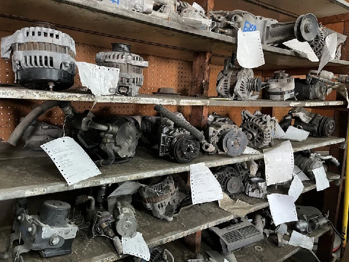 Auto parts on shelves, labeled and organized.