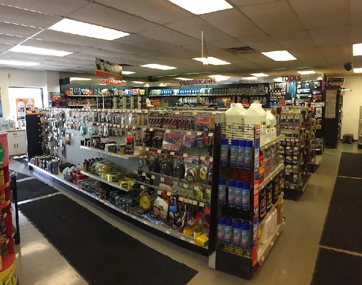 Auto parts store interior with product displays.