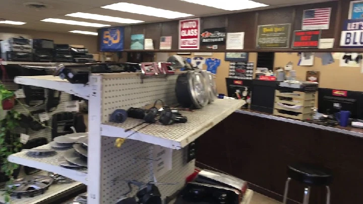 Auto parts store interior with various items displayed.