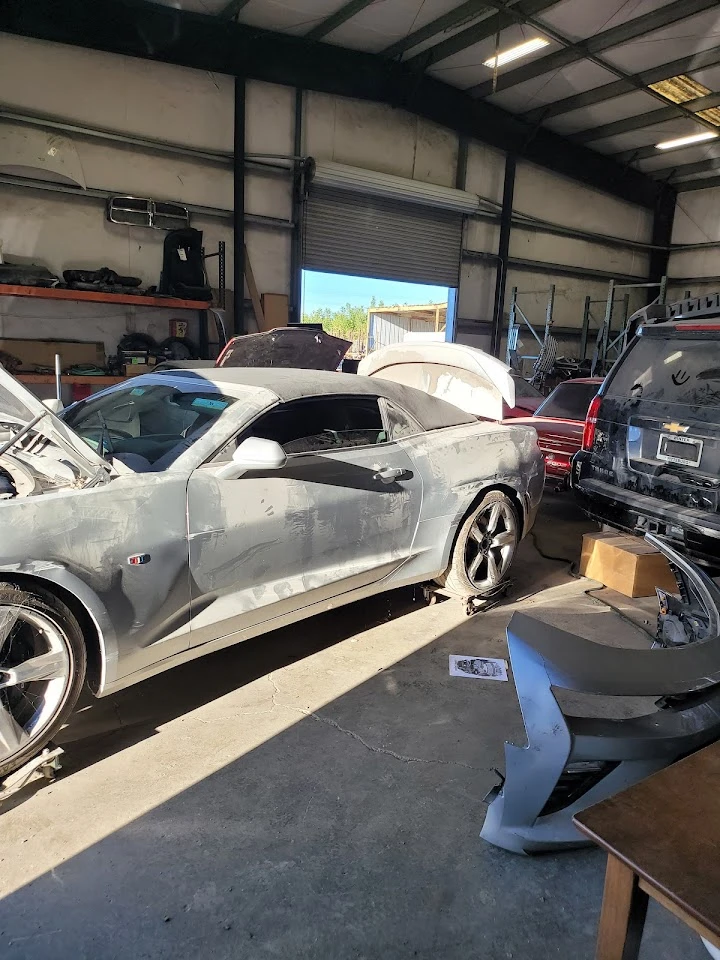 Auto repair shop with cars and equipment.