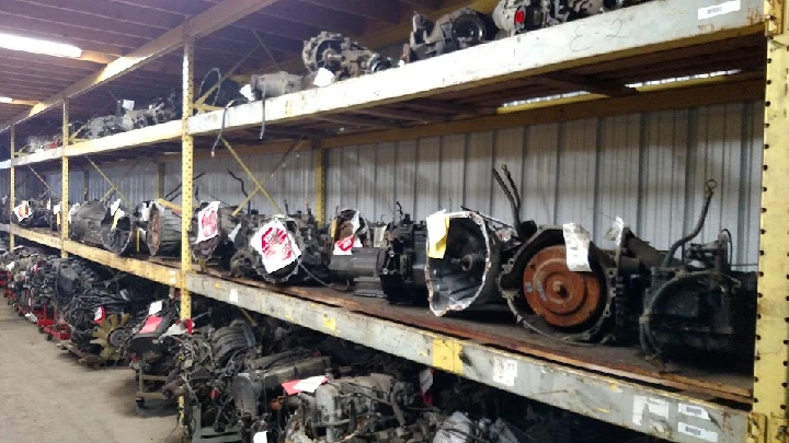 Auto salvage yard with rows of engines and parts.