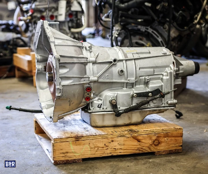 Automotive transmission on a wooden pallet.