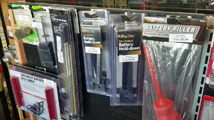 Battery accessories on display at Ace Auto Parts.