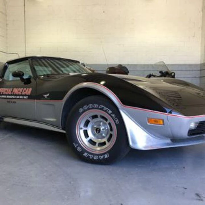 Classic race car in sleek black and silver design.