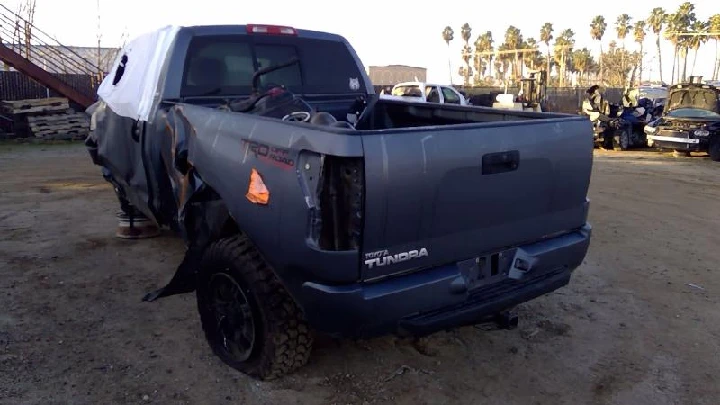 Damaged Toyota Tundra in recycling yard.