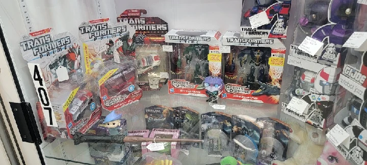 Display of Transformers toys and collectibles.