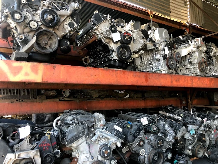 Engines stacked in a salvage yard.