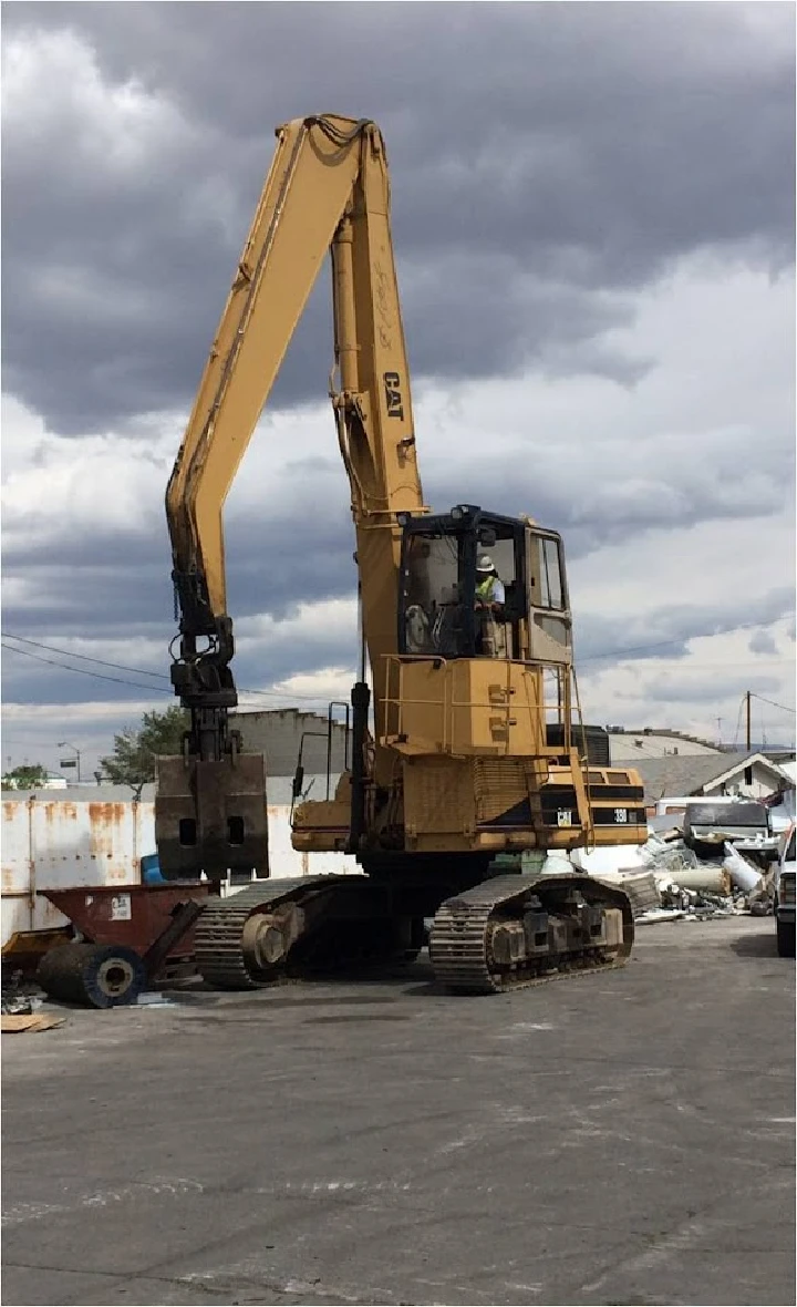 Excavator at Reno Salvage Company in operation.