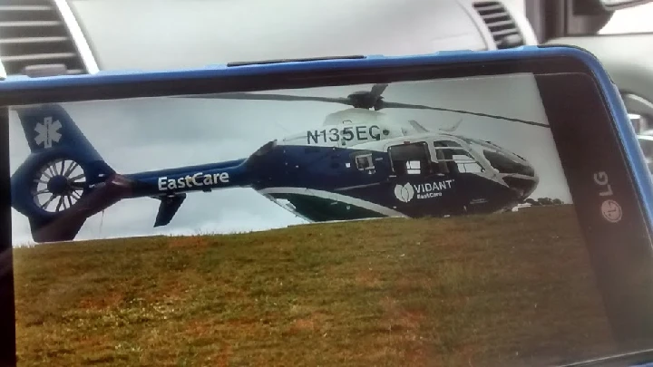 Helicopter on the ground near Wagner's Auto Salvage.