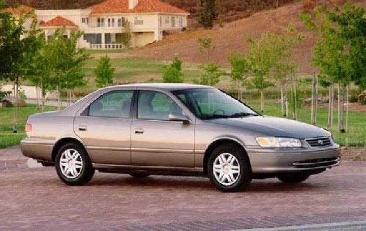 Honda sedan parked in a scenic area.