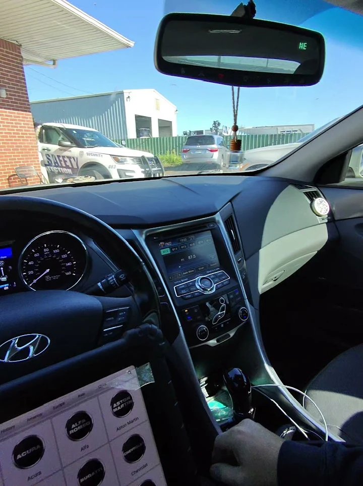 Interior view of a Hyundai car with dashboard displays.