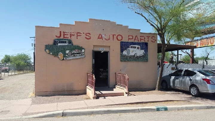 Jeff's Used Parts storefront with vintage car signage.