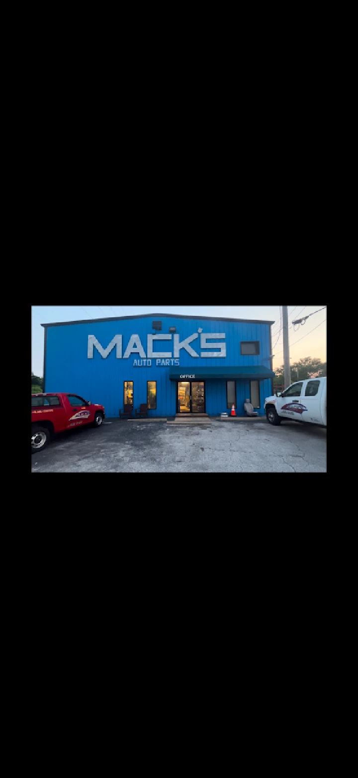 Mack's Auto Parts building exterior at dusk.