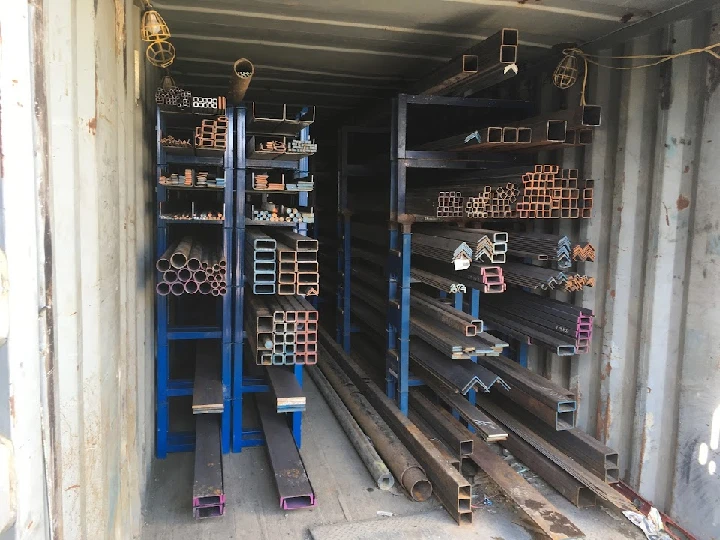 Metal pipes and scrap materials organized for recycling.