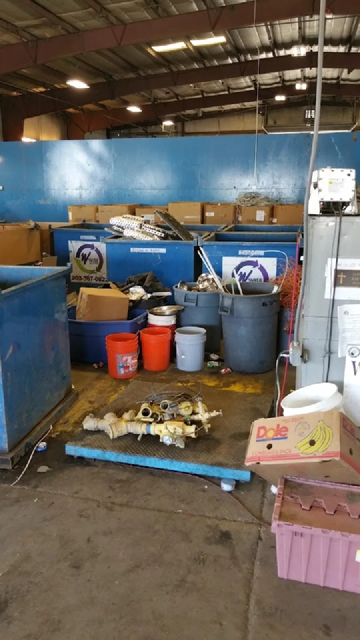 Metal and recycling bins in a warehouse setting.