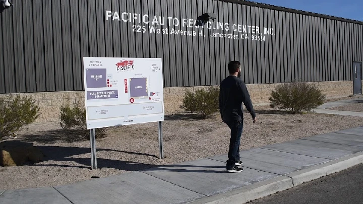 Pacific Auto Recycling Center site with direction sign.