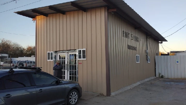 PART S MART LLC building exterior with a parked car.