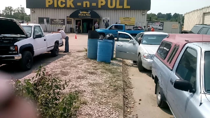 Pick-n-Pull salvage yard with various vehicles.