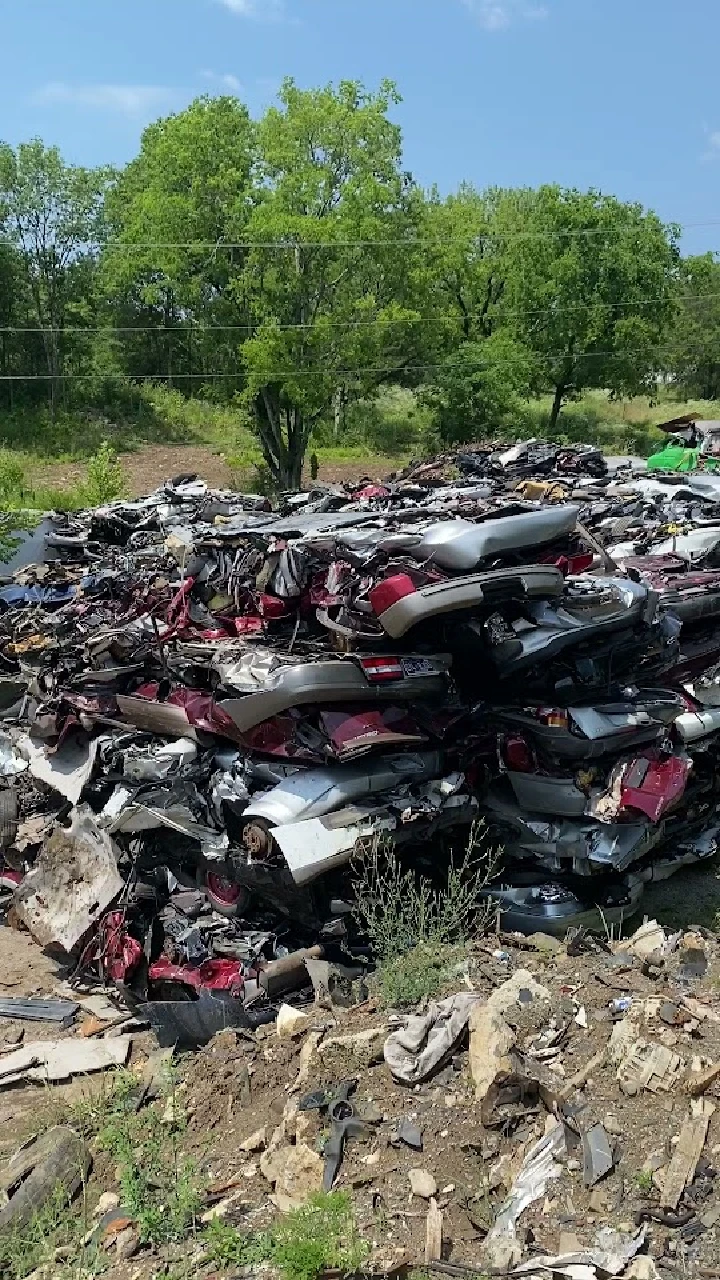 Piled scrap cars at A & C Auto Parts in Nashville.