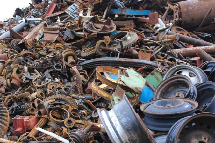 Piles of assorted scrap metal and machinery parts.