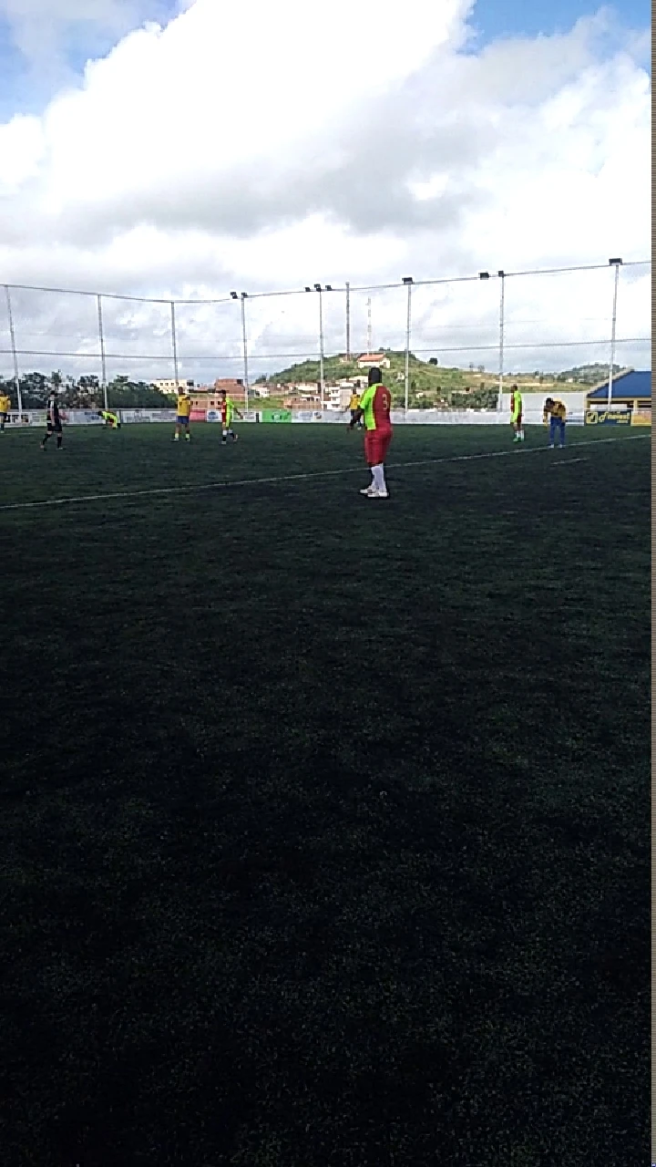 Players in action at a soccer field.