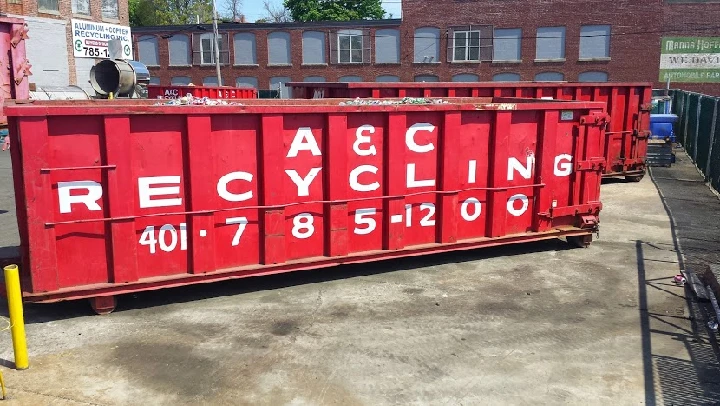 Red recycling bins for aluminum and copper collection.