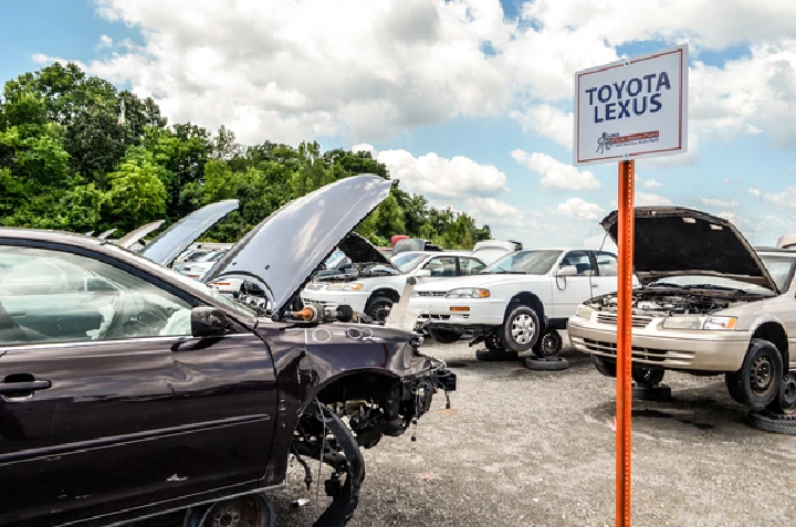 Salvage yard with Toyota and Lexus vehicles.