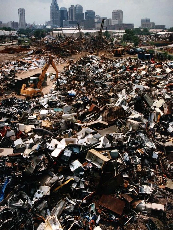 Scrapyard filled with metal debris and equipment.