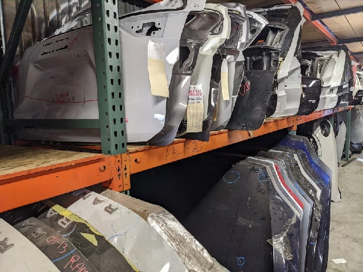 Shelves of auto body parts at Bigs Auto Parts.