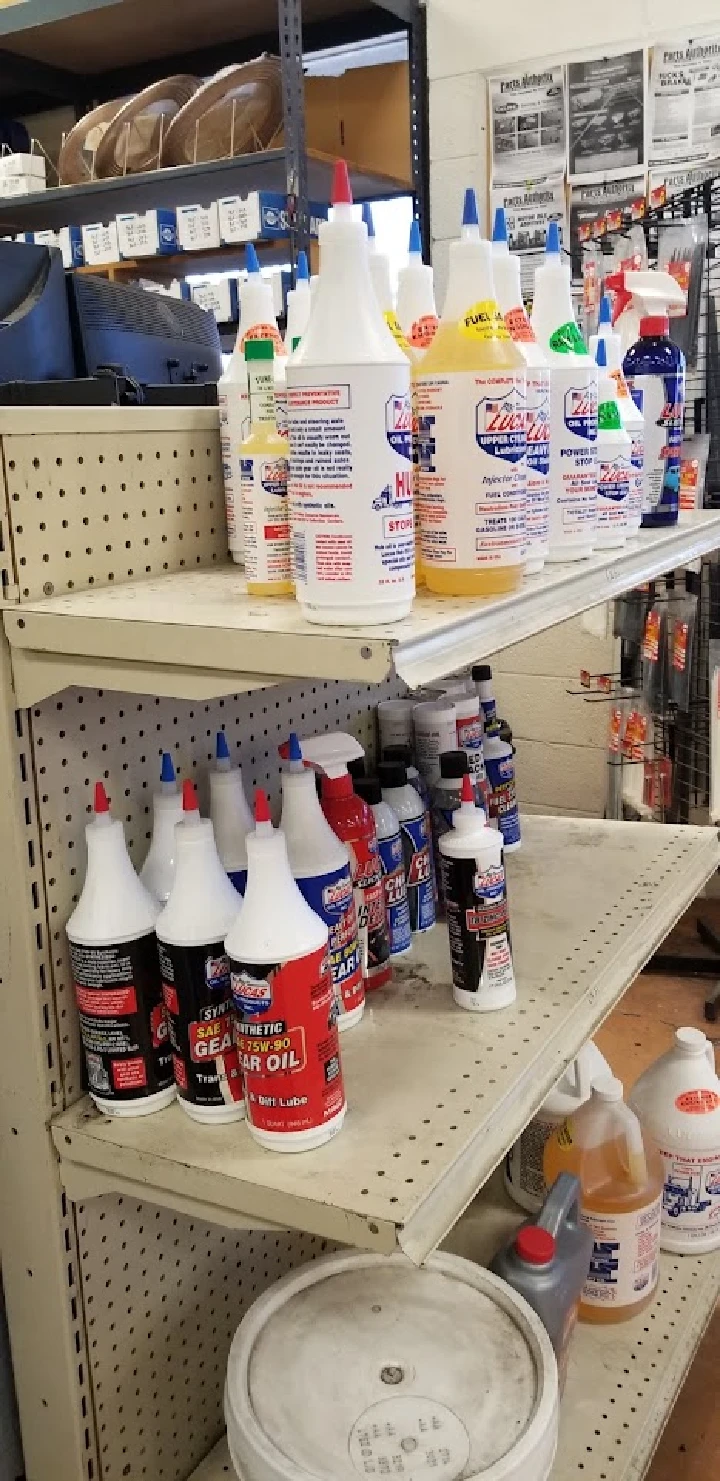 Shelves stocked with various car maintenance fluids.