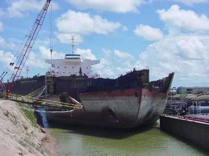 Ship being docked for metal recycling operations.