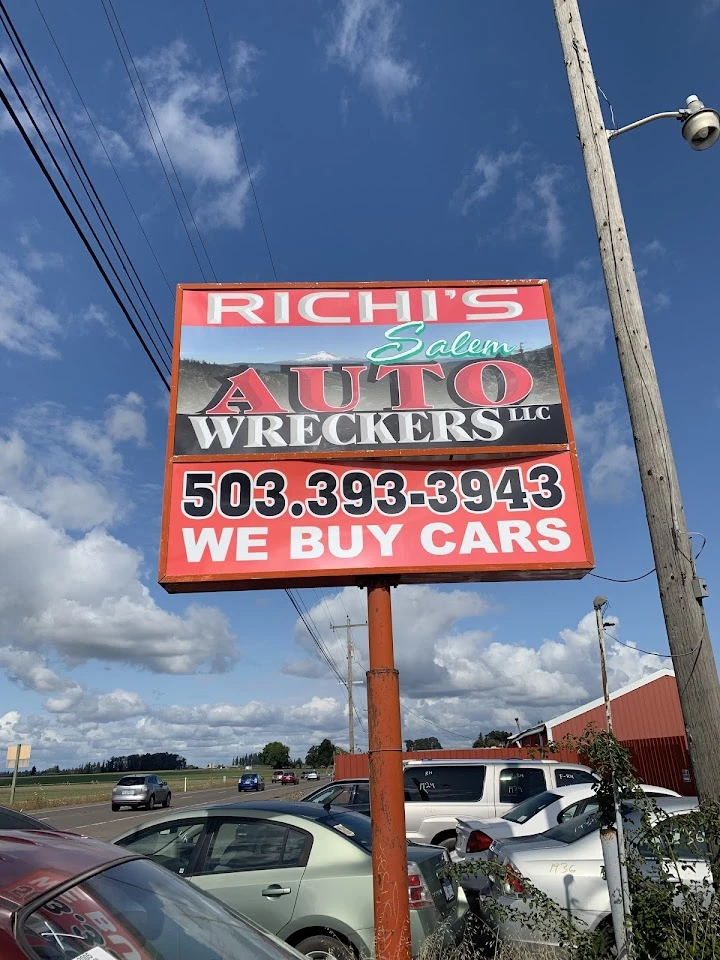 Sign for Richi's Salem Auto Wreckers, buying cars.