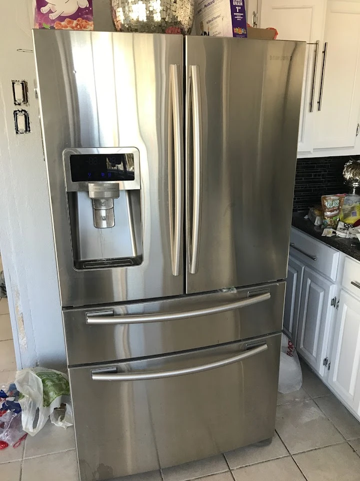 Stainless steel refrigerator in a kitchen.