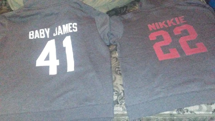 Two sweatshirts displaying names and numbers.