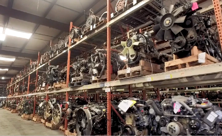 Warehouse filled with truck engines and parts.