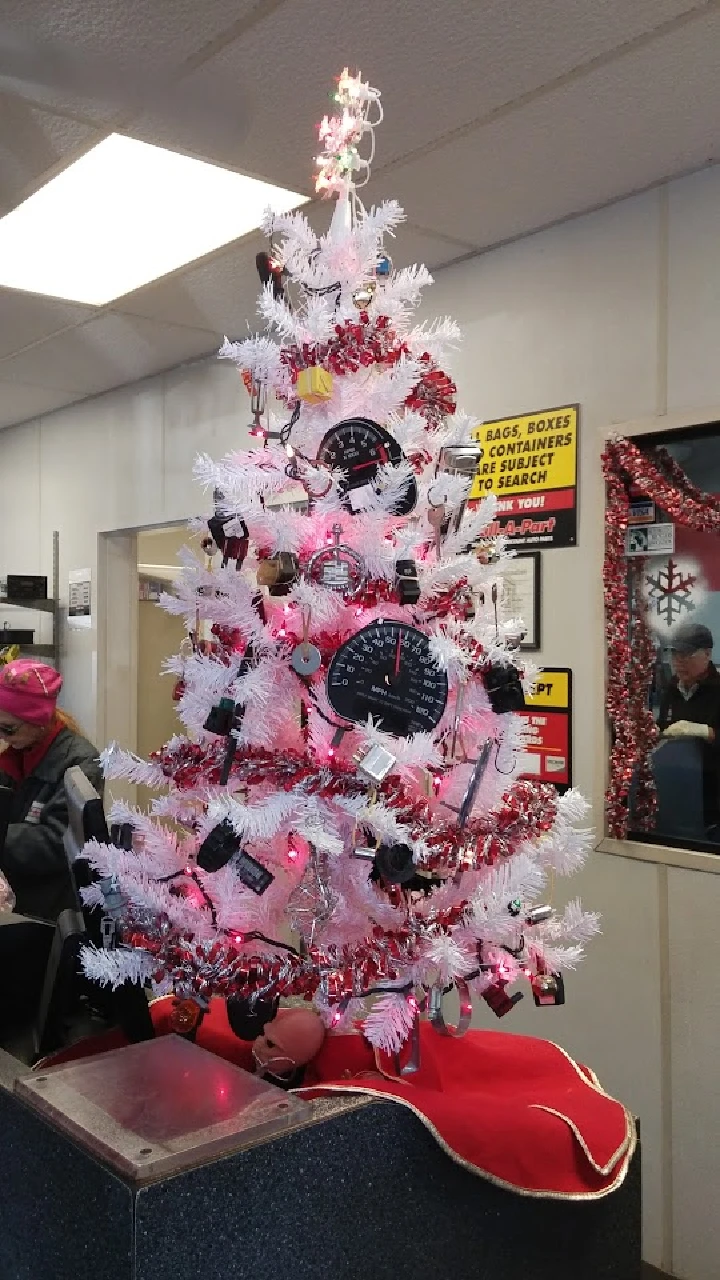 White Christmas tree decorated with automotive parts.