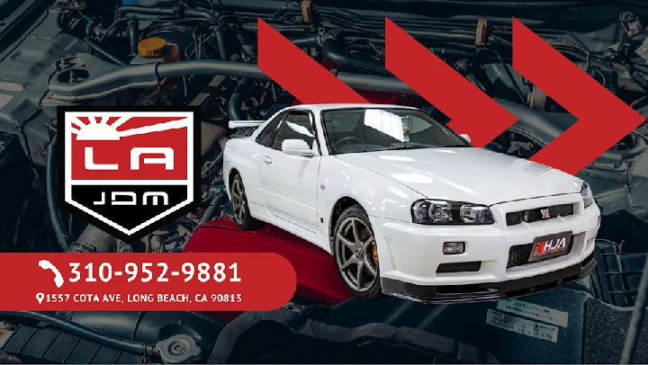 White sports car with LA JDM logo and contact info.