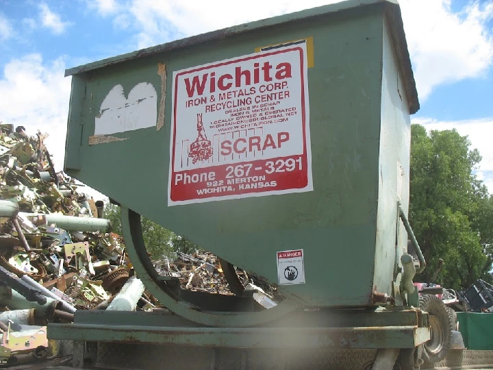 Wichita Iron & Metal recycling bin and scrap pile.