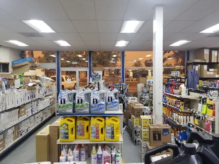 Auto parts store interior with various products displayed.