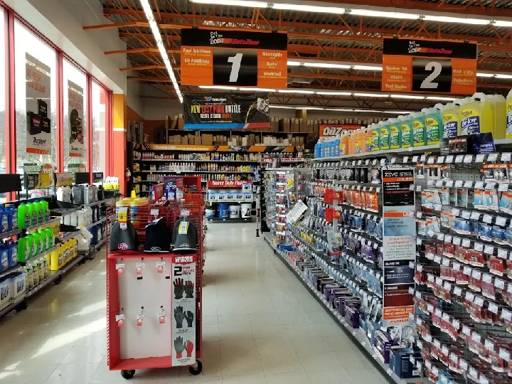 AutoZone store interior with shelves of auto parts.