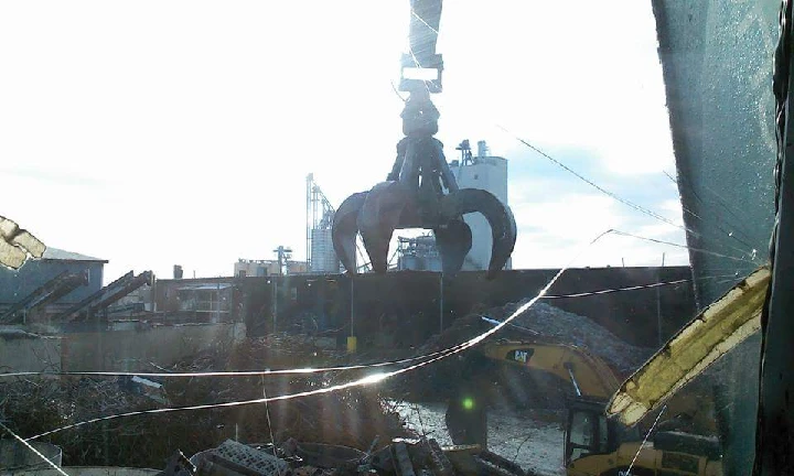 Crane lifting metal at Springfield Iron & Metal.