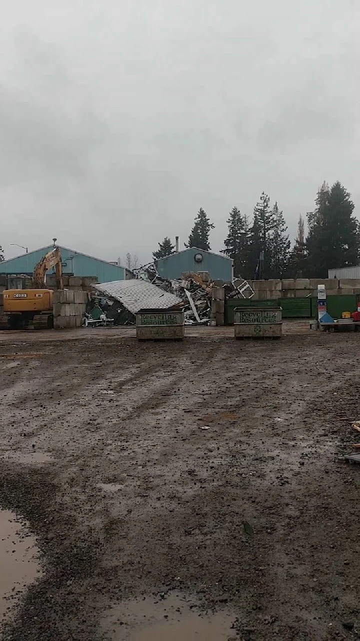 Recycling facility with machinery and containers.