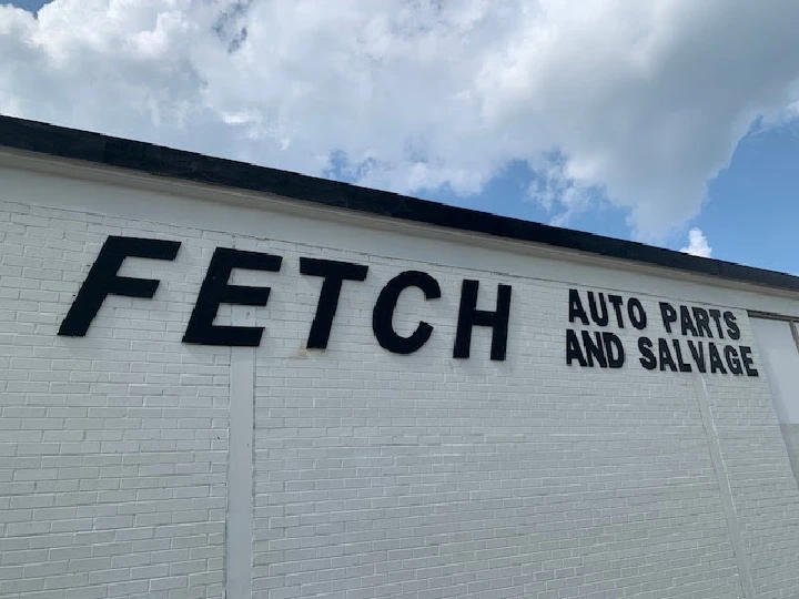 Sign for Fetch Auto Parts and Salvage building.