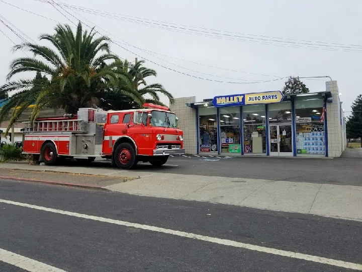 Valley Auto Parts storefront with classic fire truck.