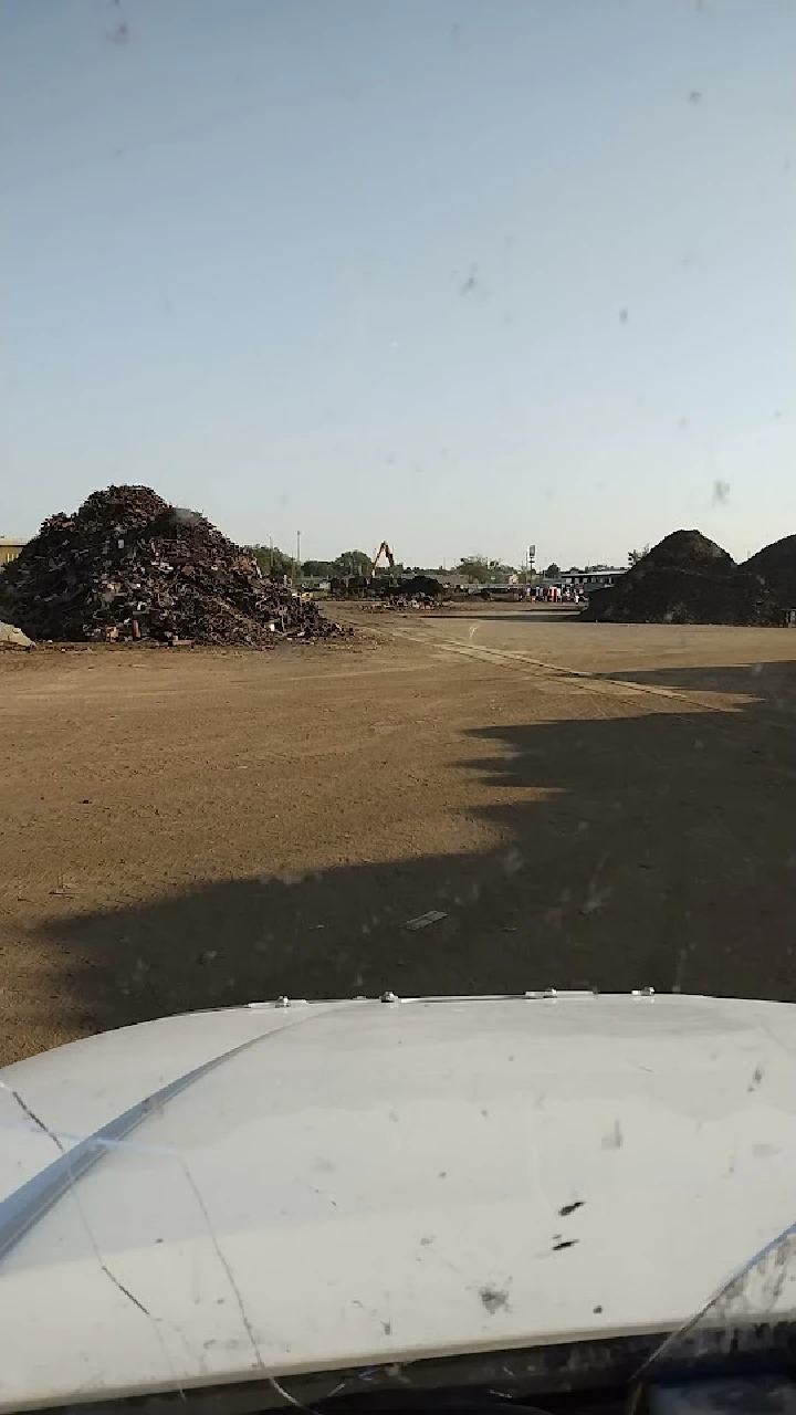 View of a recycling yard with metal piles.