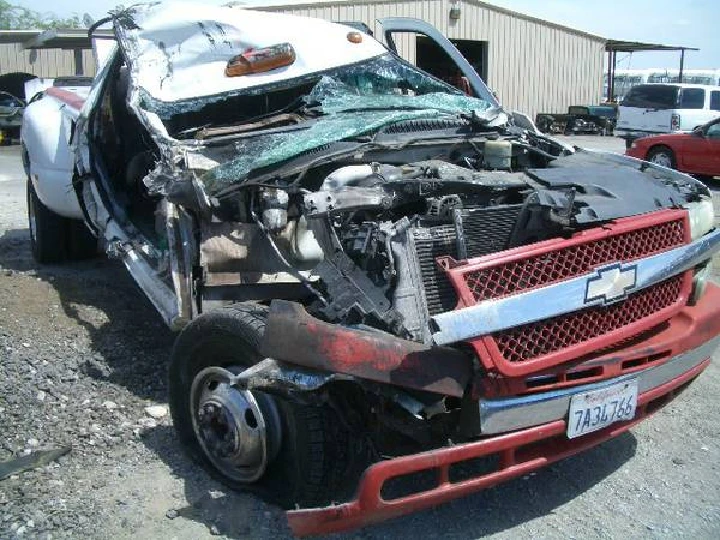 Damaged truck at U-Pull Auto Parts recycling yard.